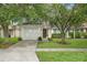 Charming single-story home with a well-manicured lawn and inviting curb appeal at 18106 Canal Pointe St, Tampa, FL 33647