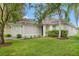 Attractive single-story home featuring a lush green lawn and a cozy, welcoming design at 18106 Canal Pointe St, Tampa, FL 33647