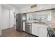 Modern kitchen design with stainless steel appliances, white cabinets, and open layout at 18106 Canal Pointe St, Tampa, FL 33647