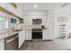 Bright, modern kitchen with stainless steel appliances, white cabinets, and ample counter space at 18106 Canal Pointe St, Tampa, FL 33647