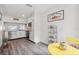 Bright kitchen with white cabinets, stainless steel appliances, and modern gray flooring at 18106 Canal Pointe St, Tampa, FL 33647