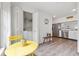 Bright breakfast nook adjacent to an open kitchen area featuring white appliances at 18106 Canal Pointe St, Tampa, FL 33647