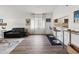 Spacious living room with counter seating, natural light, and modern furnishings at 18106 Canal Pointe St, Tampa, FL 33647