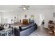 Bright living room features an open layout, wood floors, and neutral color palette at 18106 Canal Pointe St, Tampa, FL 33647