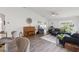 Open-concept living room with vaulted ceilings, piano and abundant natural light at 18106 Canal Pointe St, Tampa, FL 33647