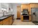 Kitchen featuring stainless appliances, wood cabinets, and stylish backsplash at 1871 Prospect St, Sarasota, FL 34239