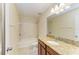 Granite countertop, sink, shower, and toilet in a well-lit bathroom with tile flooring at 1912 Hawks View Dr, Ruskin, FL 33570