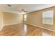 A spacious bedroom with lots of natural light coming through the windows and a ceiling fan at 1912 Hawks View Dr, Ruskin, FL 33570