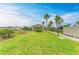 Community recreation area showcasing gazebo and lush greenery with sidewalk at 1912 Hawks View Dr, Ruskin, FL 33570