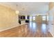 Open concept living room and kitchen area featuring dark cabinets and hardwood flooring at 1912 Hawks View Dr, Ruskin, FL 33570