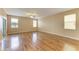 Spacious living room with hardwood floors and large windows providing natural light throughout at 1912 Hawks View Dr, Ruskin, FL 33570