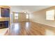 Spacious living room with hardwood floors, neutral paint, and abundant natural light from large windows at 1912 Hawks View Dr, Ruskin, FL 33570