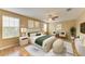 Beautifully furnished main bedroom with a ceiling fan, elegant decor and lots of natural light at 1912 Hawks View Dr, Ruskin, FL 33570