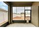 Enclosed patio offering views of fenced backyard with fire pit and pergola at 1912 Hawks View Dr, Ruskin, FL 33570