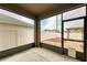 Screened patio with view of a fenced backyard with pavers and a pergola at 1912 Hawks View Dr, Ruskin, FL 33570