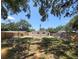 Spacious backyard featuring new fencing offering privacy and ample room for outdoor activities at 2035 Vinson Ave, Sarasota, FL 34232