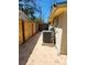 Backyard view with a fenced in walkway and an air conditioner at 2035 Vinson Ave, Sarasota, FL 34232