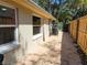 Backyard of a house with a narrow walkway on the side at 2035 Vinson Ave, Sarasota, FL 34232