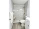 Stylish bathroom with sleek vanity, modern fixtures and a walk-in shower with a tile surround at 2035 Vinson Ave, Sarasota, FL 34232