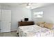 Cozy bedroom features light walls, a ceiling fan and a window at 2035 Vinson Ave, Sarasota, FL 34232