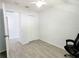 Bright bedroom features modern gray tile and a ceiling fan at 2035 Vinson Ave, Sarasota, FL 34232