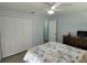 Bright bedroom with ample closet space and a ceiling fan at 2035 Vinson Ave, Sarasota, FL 34232