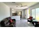 Open living space featuring modern decor, sleek tile flooring, and natural lighting at 2035 Vinson Ave, Sarasota, FL 34232