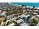 A beautiful coastal home with an inviting outdoor pool area near the sandy beach and turquoise waters at 204 75Th St, Holmes Beach, FL 34217