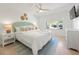 Relaxing bedroom with ceiling fan and view of the outdoors at 204 75Th St, Holmes Beach, FL 34217