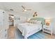 Bright bedroom featuring coastal decor and an en-suite bathroom at 204 75Th St, Holmes Beach, FL 34217