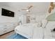 Well-lit bedroom featuring coastal decor and a TV at 204 75Th St, Holmes Beach, FL 34217