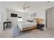 Comfortable bedroom offering a woven bedframe, modern decor and dedicated workspace for convenience at 204 75Th St, Holmes Beach, FL 34217