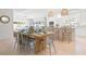 Bright dining area boasts an open layout with wood table, seating for six, and coastal decor at 204 75Th St, Holmes Beach, FL 34217