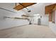 Spacious garage with shelving, water heater, storage, and a bright interior at 204 75Th St, Holmes Beach, FL 34217