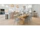 Modern kitchen with stainless steel appliances, white cabinetry, and island seating, perfect for entertaining at 204 75Th St, Holmes Beach, FL 34217
