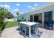 Outdoor patio area featuring a dining table and chairs perfect for entertaining guests at 204 75Th St, Holmes Beach, FL 34217