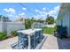 Outdoor patio area featuring a dining table and chairs perfect for entertaining guests at 204 75Th St, Holmes Beach, FL 34217
