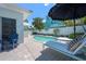 Inviting pool area with lounge chairs, a wooden deck, privacy fence and view of the neighborhood at 204 75Th St, Holmes Beach, FL 34217