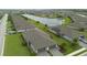 Aerial view of a well-planned community with single Gathering homes and a serene lake at 2193 Bonito Way, Port Charlotte, FL 33953