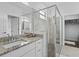 Bathroom featuring granite countertops, a glass shower, and a walk-in closet at 2193 Bonito Way, Port Charlotte, FL 33953