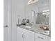 Bathroom featuring granite countertops, a large mirror, and a modern shower at 2193 Bonito Way, Port Charlotte, FL 33953