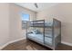 Bedroom with bunk beds, wood floors, ceiling fan and plenty of natural light at 2193 Bonito Way, Port Charlotte, FL 33953