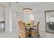 Bright dining room showcasing modern lighting, neutral paint, and stylish decor for a welcoming atmosphere at 2193 Bonito Way, Port Charlotte, FL 33953