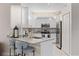 Modern kitchen featuring granite countertops, stainless steel appliances, and ample cabinet space for storage at 2193 Bonito Way, Port Charlotte, FL 33953