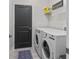 Laundry room featuring a washing machine, a dryer and an inspirational saying at 2193 Bonito Way, Port Charlotte, FL 33953