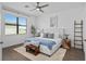 Serene main bedroom with natural light, ceiling fan, and modern decor, a perfect retreat at 2193 Bonito Way, Port Charlotte, FL 33953