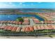 Beautiful aerial view of a home in a lakeside community with views of the serene lake at 224 Soliera St, Nokomis, FL 34275