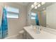 Well-lit bathroom with a large mirror, modern fixtures, and neutral color scheme at 224 Soliera St, Nokomis, FL 34275