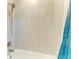 Clean bathroom featuring a shower and tub combination with tiled walls and modern fixtures at 224 Soliera St, Nokomis, FL 34275