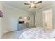 Bedroom with a dresser, a TV and an view of the interior hallway at 224 Soliera St, Nokomis, FL 34275